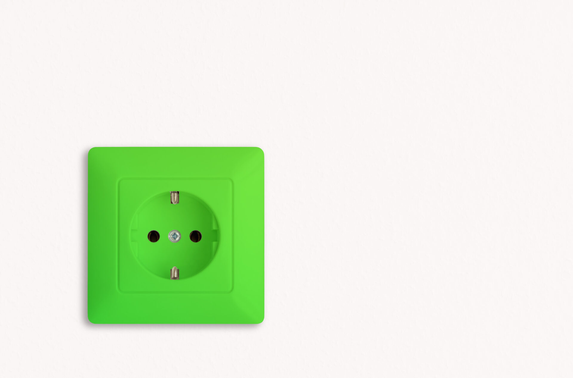 green electrical power socket on white background, electric power outlet, renewable energy, green power Weisse Wand mit grosser güner Steckdose